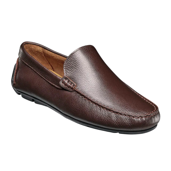 Dark brown leather loafer with a simple slip-on design and visible stitching along the edges. The shoe has a leather upper and cushioned interior.