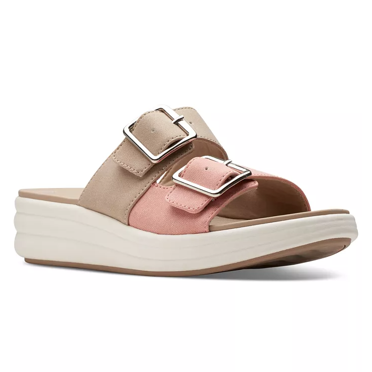 A pair of two-strap beige and pink platform sandals with buckle closures.