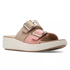 A pair of two-strap beige and pink platform sandals with buckle closures.