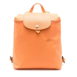 Orange Longchamp Le Pliage Xtra Backpack featuring a flap closure with button snap, top handle, embossed logo, and adjustable straps.