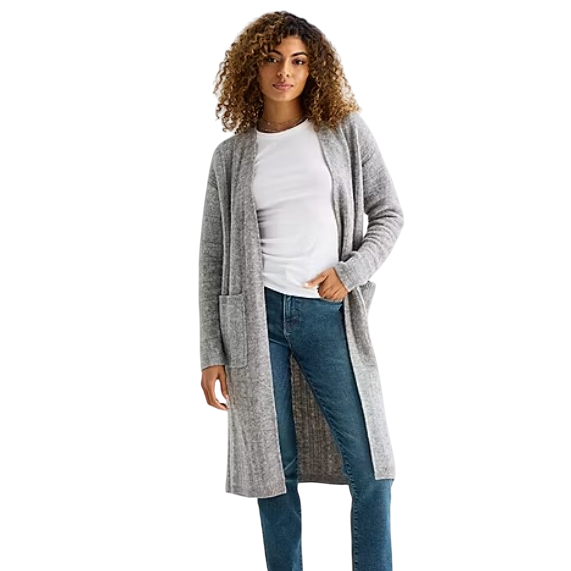 A person wearing a long gray cardigan over a white T-shirt and blue jeans.