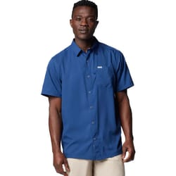 A man is wearing a blue, short-sleeve button-up shirt with a chest pocket, paired with beige pants.