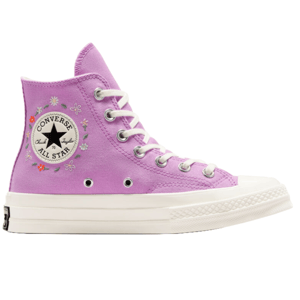 Lilac Converse Chuck Taylor All Star shoes with floral embroidery around the logo patch, featuring white laces, rubber toe cap, and a white midsole with a black stripe along the back.