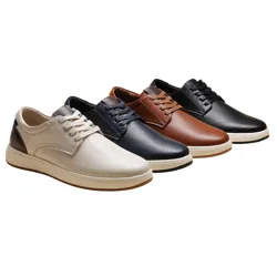 Four pairs of perforated lace-up shoes in beige, navy, brown, and black, each with contrasting soles, are displayed.