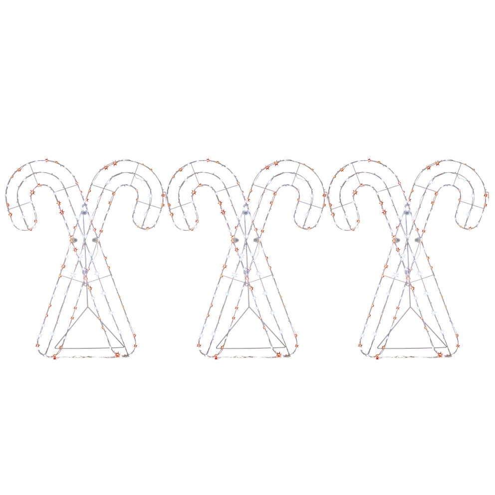 Three metal frames shaped like crossed candy canes decorated with string lights.