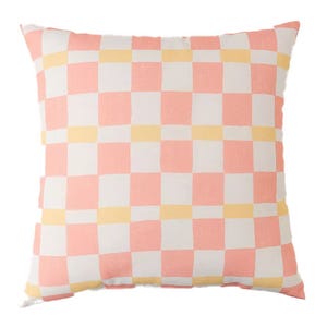 A square cushion with a pastel checkered pattern in pink, white, and yellow.