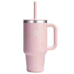 A pink insulated tumbler with a handle and straw, featuring a stainless steel rim and a logo on the front.