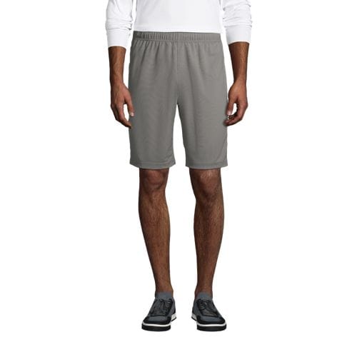 Gray mesh gym shorts with an elastic waistband, hitting above the knee, worn with a white shirt and black sneakers.