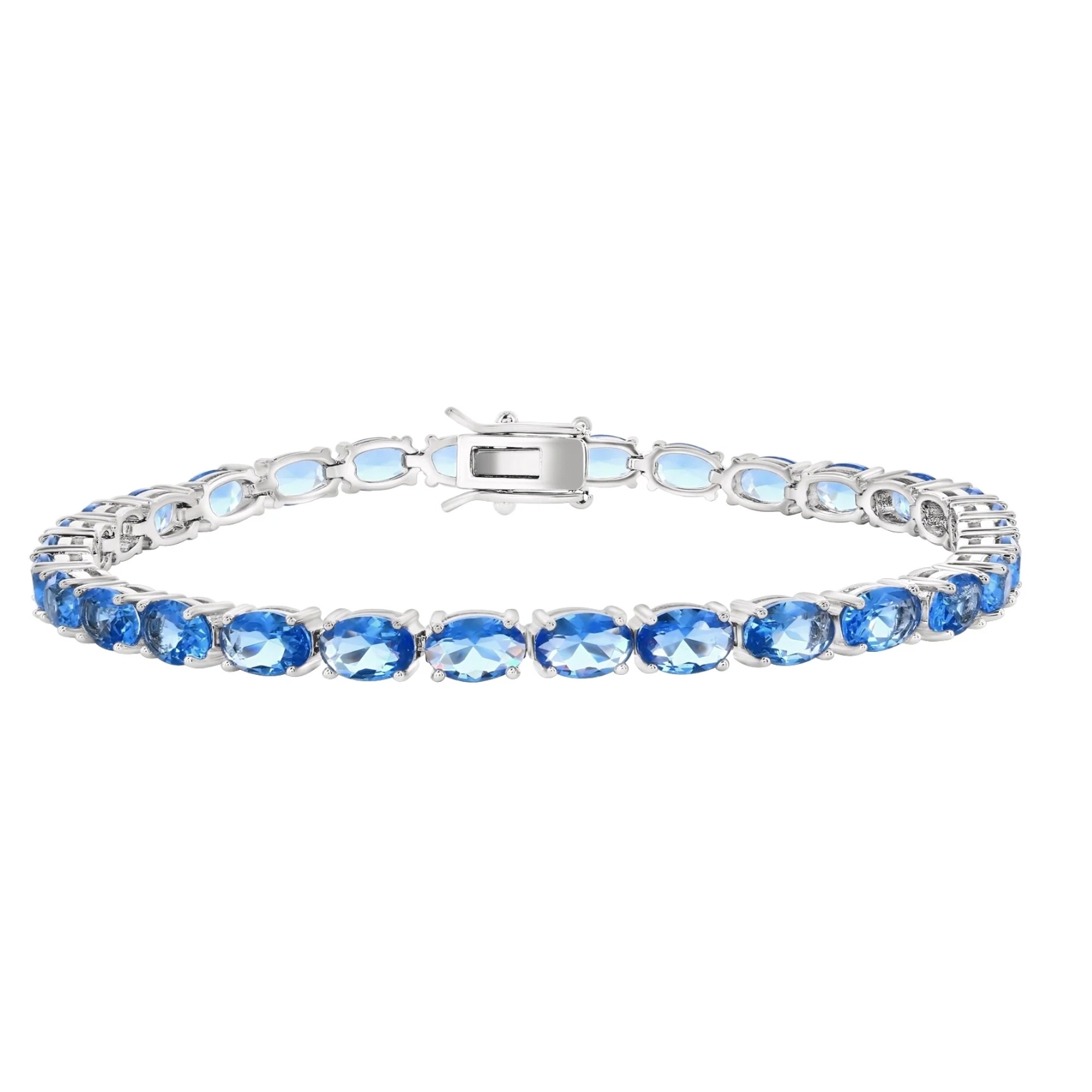 A sleek silver tennis bracelet featuring a row of oval-cut blue gemstones, set in prongs with a secure clasp.