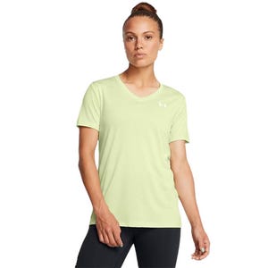 A woman wearing a light green Under Armour T-shirt with short sleeves and a small logo on the chest, paired with black leggings.