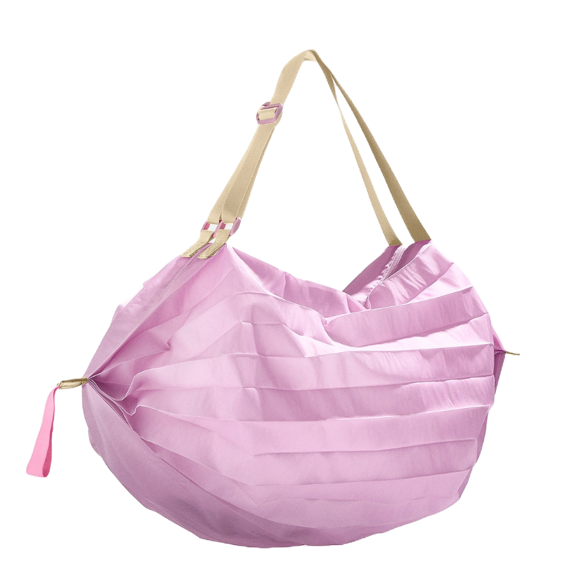 A light pink pleated bag with tan adjustable straps, featuring a zipper pull detail on one side.