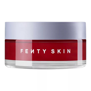 Fenty Skin Cherry Face Mask features a sleek red container with a light-colored lid. The brand name \“FENTY SKIN\“ is prominently displayed on the front.