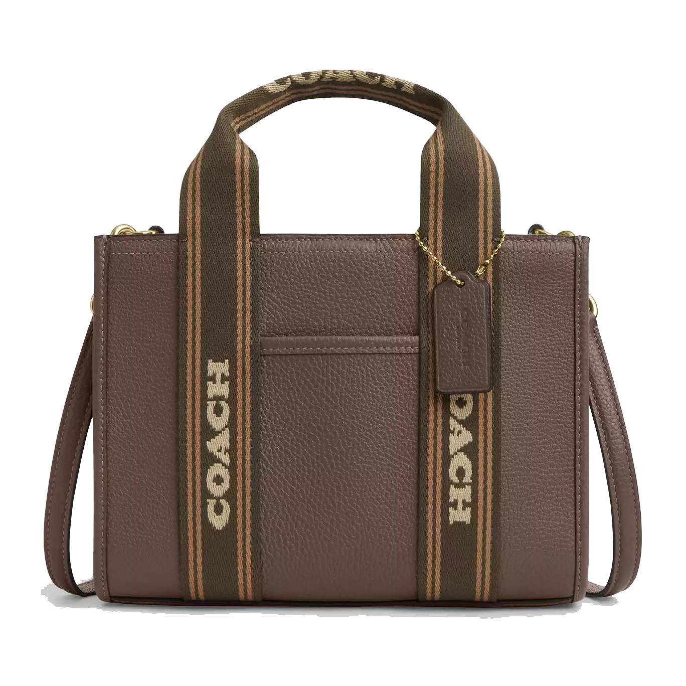 A brown Coach tote bag with textured leather, featuring dual fabric handles adorned with the Coach logo, a detachable shoulder strap, and a branded tag hanging from a gold chain.
