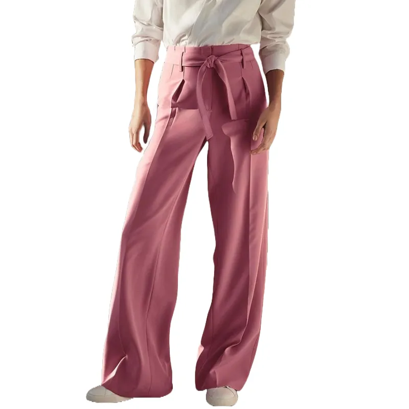 Pink wide-leg trousers feature a high waist with a tied belt, paired with a white long-sleeve blouse. The pants have a relaxed fit and a smooth fabric, providing a sophisticated and stylish look.