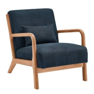 A modern armchair with a natural wood frame and rounded armrests, featuring dark blue, corduroy-style upholstery. Includes a matching lumbar pillow for added comfort.