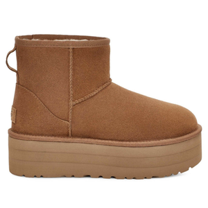 Brown platform ankle boot with shearling lining and pull tab on the back.