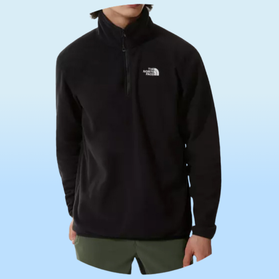 Black half-zip pullover with The North Face logo on the chest, paired with olive green shorts.