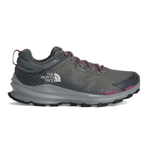 The North Face VECTIV trail running shoe in dark gray with pink accents features a mesh upper, DRYVENT technology, and a grippy sole.