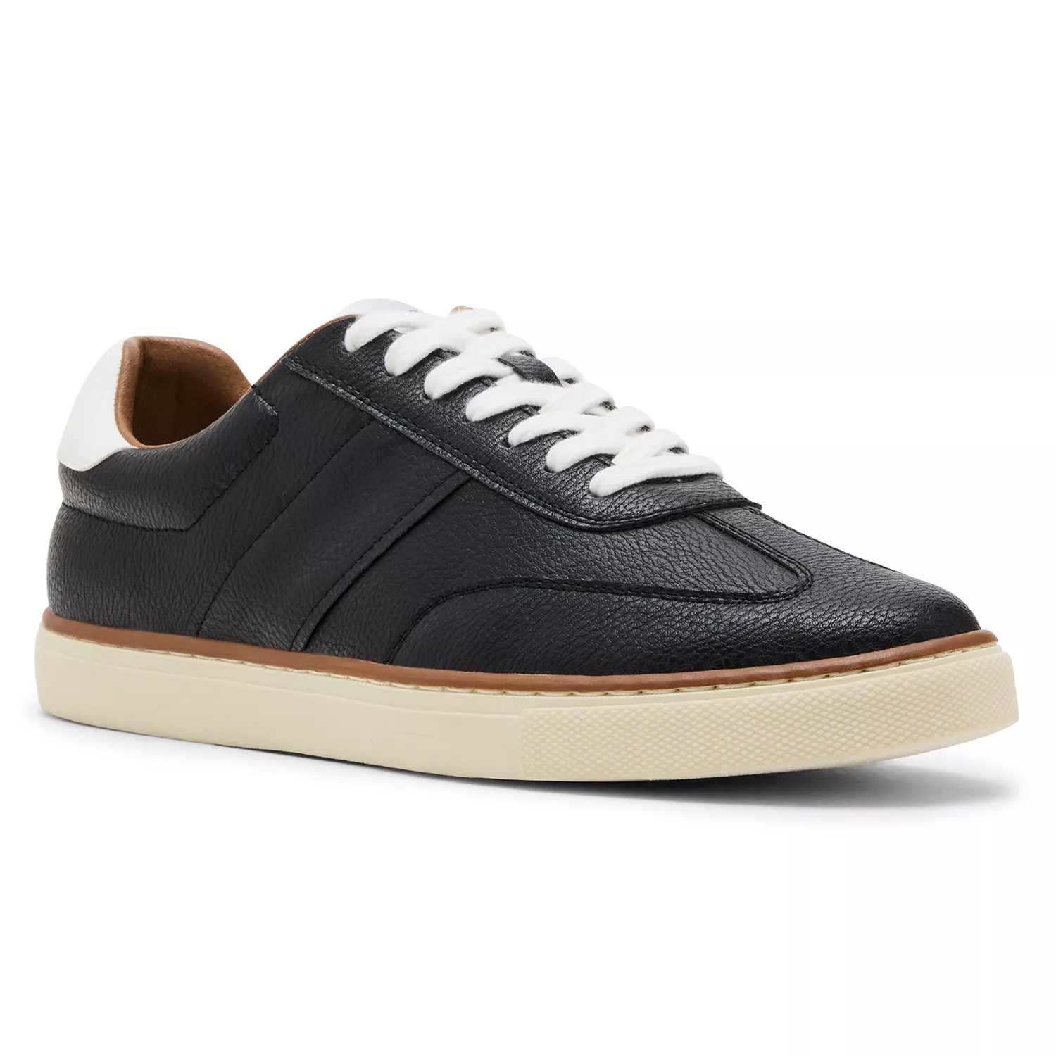 A low-top sneaker with textured black leather upper, white laces, a padded collar, and a cream rubber sole.