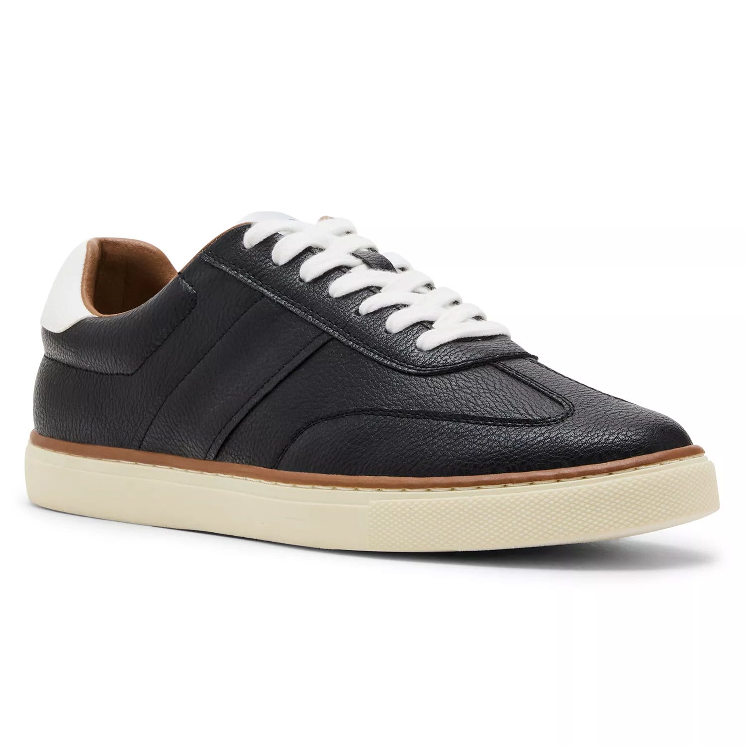 A low-top sneaker with textured black leather upper, white laces, a padded collar, and a cream rubber sole.