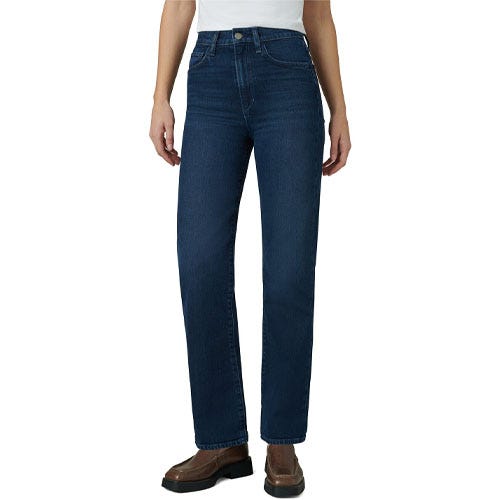 High-rise skinny jeans in dark blue denim with a classic five-pocket design and button closure, paired with brown shoes and a white top.