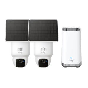 Two Eufy solar-powered security cameras with black solar panels on top and a white Eufy security hub.