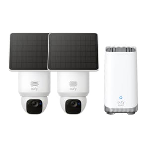Two Eufy solar-powered security cameras with black solar panels on top and a white Eufy security hub.