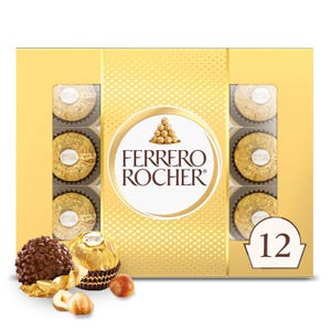 A 12-count Ferrero Rocher Gift Box featuring individually wrapped hazelnut chocolates with a creamy filling, encased in a crunchy shell, all presented in gold foil. The box design includes a visible arrangement of chocolates and a prominent brand logo.