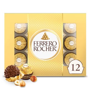 A 12-count Ferrero Rocher Gift Box featuring individually wrapped hazelnut chocolates with a creamy filling, encased in a crunchy shell, all presented in gold foil. The box design includes a visible arrangement of chocolates and a prominent brand logo.