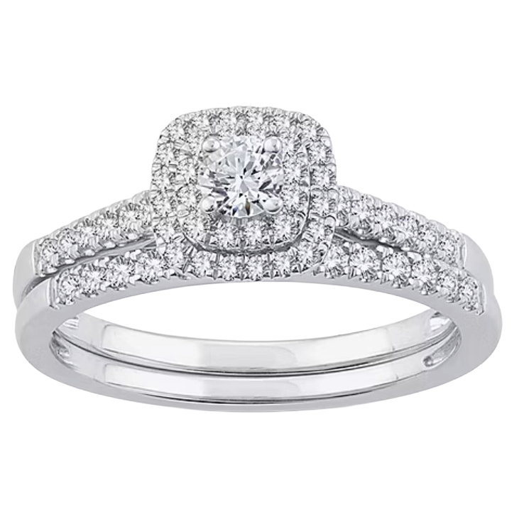A silver ring set with a central round diamond surrounded by a halo of smaller diamonds, and additional diamonds lining the split shank.