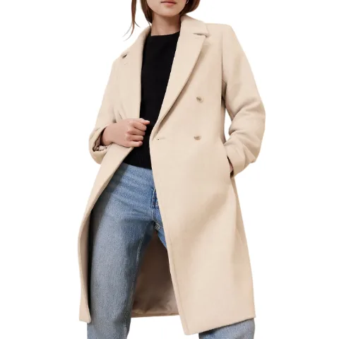 A beige topcoat from Banana Republic Factory features a double-breasted design with wide lapels, falling to a knee-length. It's paired with a black top and blue jeans, offering a classic and stylish look.