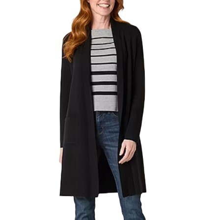A woman is wearing a long black cardigan over a gray and black striped sweater paired with blue jeans.