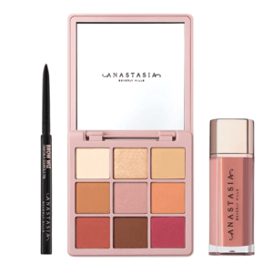 Makeup set featuring an Anastasia Beverly Hills eyeshadow palette with nine shades, a Brow Wiz pencil, and a liquid lipstick.