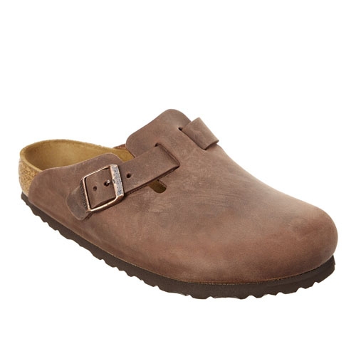 Brown leather closed-toe clog with a single adjustable buckle strap, cork footbed, and textured dark brown sole.