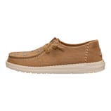 Tan casual shoe with a low profile and flat sole, featuring decorative stitching and metallic stud embellishments on the upper part.