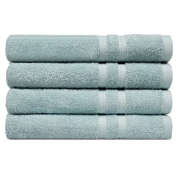 Four light blue bath towels are neatly stacked on top of each other.