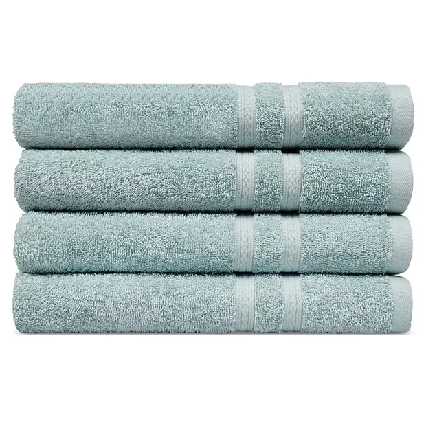 Four light blue bath towels are neatly stacked on top of each other.