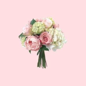 A bouquet of pink and white flowers, including roses and hydrangeas, set against a pastel pink background.