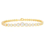 Gold tennis bracelet with round-cut stones set in individual bezel settings.