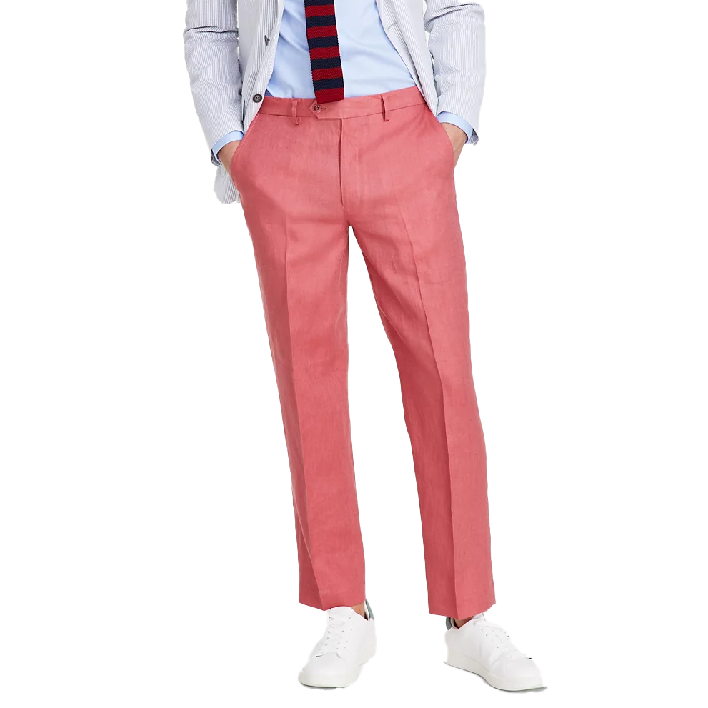 Nautica Linen Dress Pants are tailored in a coral hue with a slim fit, featuring a flat front, button waist, side pockets, and crafted from lightweight linen, paired with a light jacket, blue shirt, striped tie, and white sneakers for a smart-casual look.
