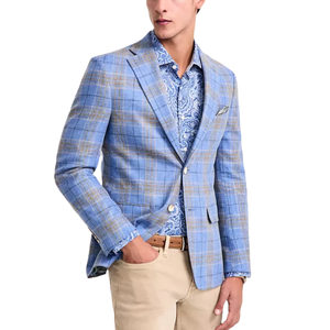 A man is wearing a light blue plaid blazer over a blue paisley shirt, paired with beige khaki pants and a brown belt.