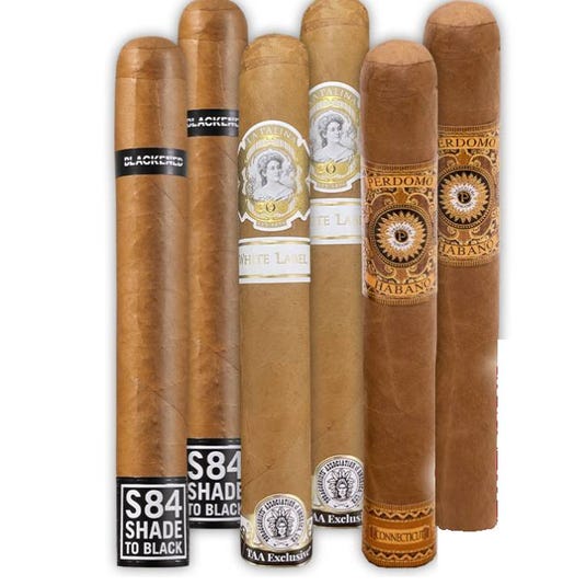 Assorted cigars featuring Blackbird, La Palina White Label, and Perdomo Habano Connecticut, each with distinctive bands and packaging.
