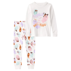 A children's pajama set featuring a white long-sleeve top with \“Ghouls can be anything!\“ and colorful ghost graphics, paired with matching pants featuring a variety of playful ghost characters.