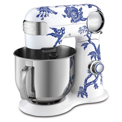 A white stand mixer with blue floral patterns, featuring a stainless steel mixing bowl and a control knob.