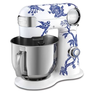 A white stand mixer with blue floral patterns, featuring a stainless steel mixing bowl and a control knob.