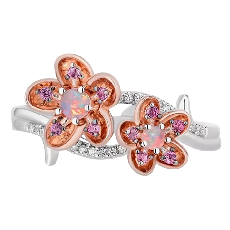 A floral ring with two rose gold flowers, featuring central opal stones and pink gemstones on the petals. The band is silver with additional small clear stones.
