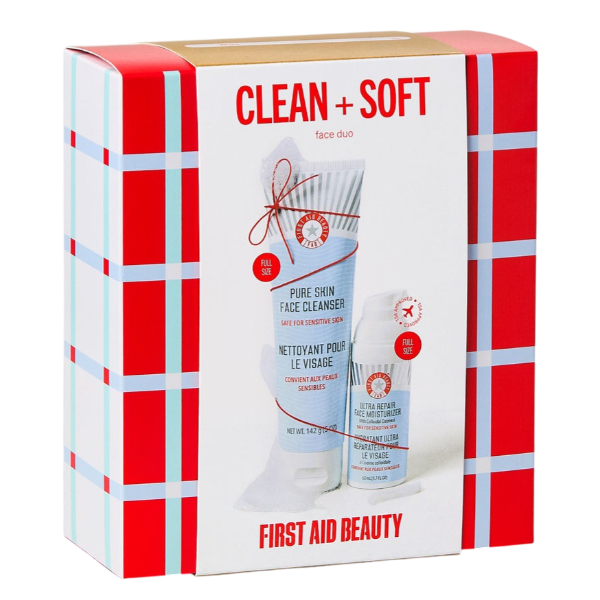 First Aid Beauty \“Clean + Soft\“ face duo includes a full-size Pure Skin Face Cleanser and Ultra Repair Face Moisturizer, safe for sensitive skin. Packaging features a red and blue plaid design.
