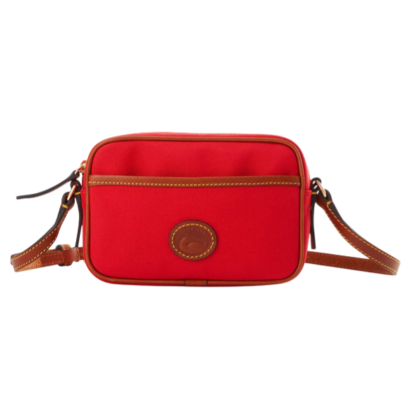 Red crossbody bag with brown leather accents and a front pocket, featuring a circular stitched logo.