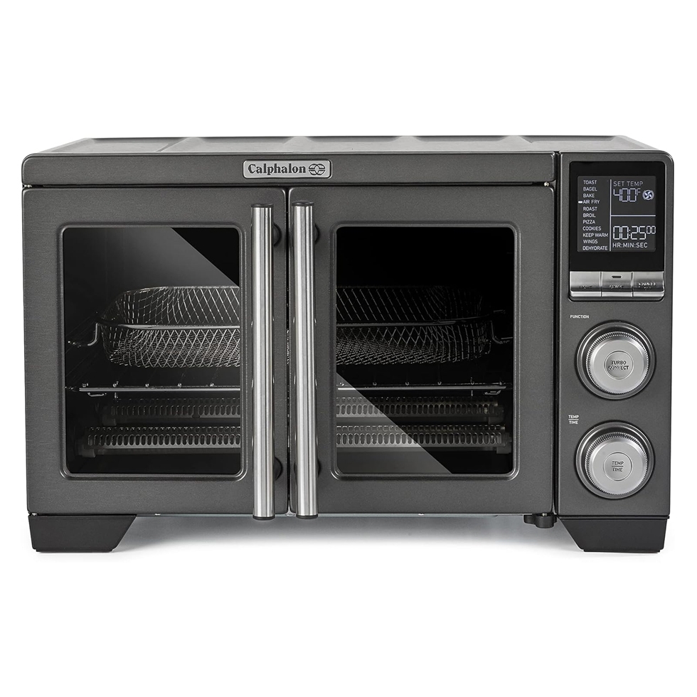 Calphalon French Door Air Fry Oven features dual glass doors, an LCD display with dials for function and temperature adjustment, and includes air fry capabilities along with various cooking modes like toast, bake, and broil.