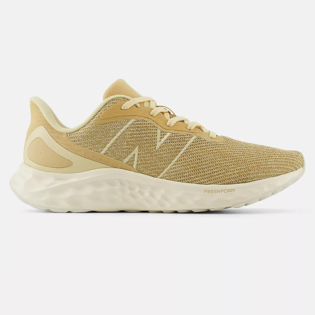Beige New Balance Fresh Foam Arishi shoes with a textured mesh upper, cream accents, and chunky white soles.